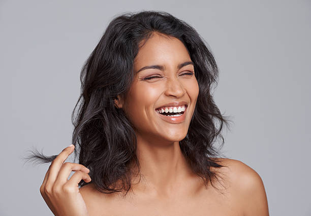 Top Benefits to Using Hair Oil for Hair Growth This Summer woman long brown hair