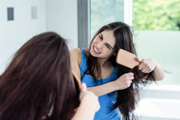 Top Benefits to Using Hair Oil for Hair Growth This Summer woman long brown hair