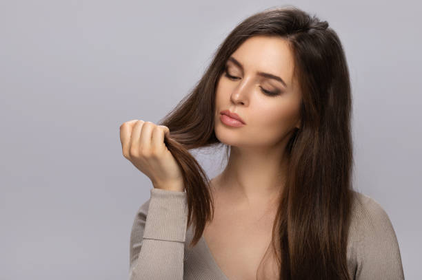 Top Benefits to Using Hair Oil for Hair Growth This Summer woman long brown hair