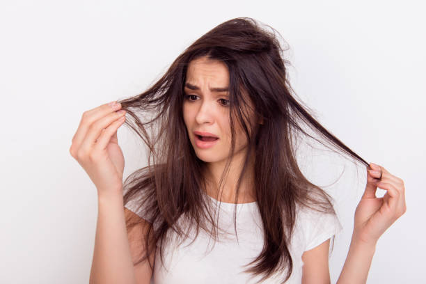 Top Benefits to Using Hair Oil for Hair Growth This Summer woman long brown hair