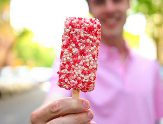 Smiling person holding a Strawberry Shortcake bar