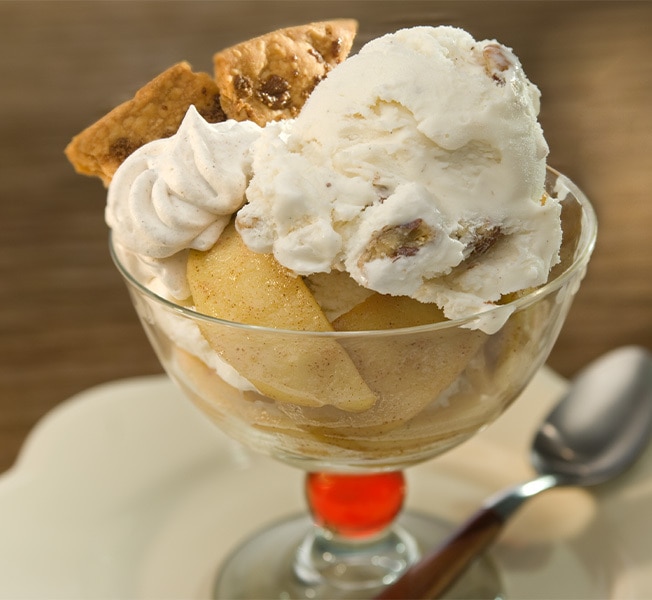 Cup of Apple pie-inspired dessert with butter pecan frozen dessert