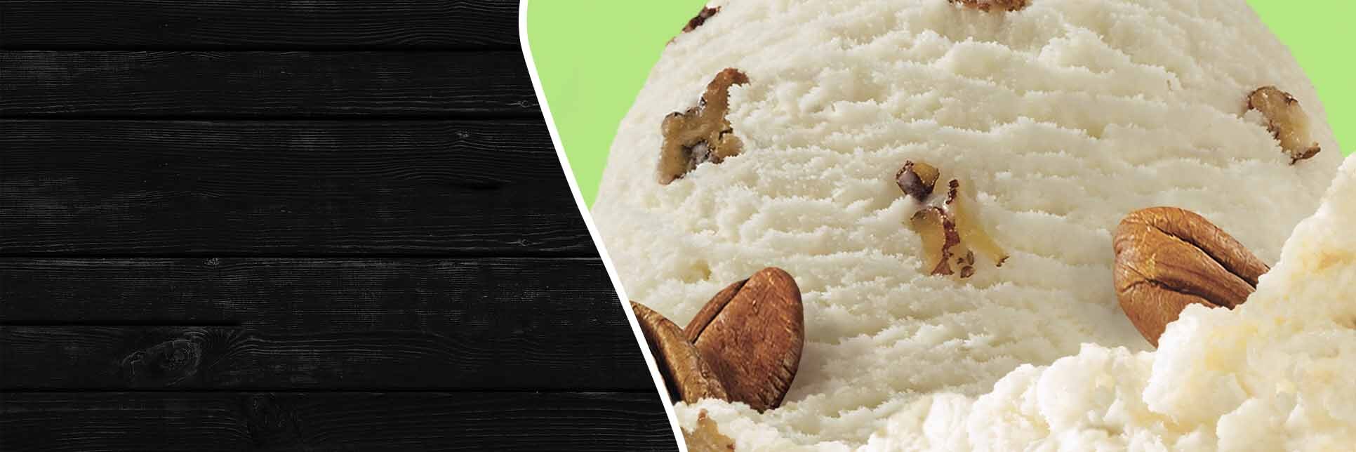 Scoop of Breyers Butter Pecan on green background