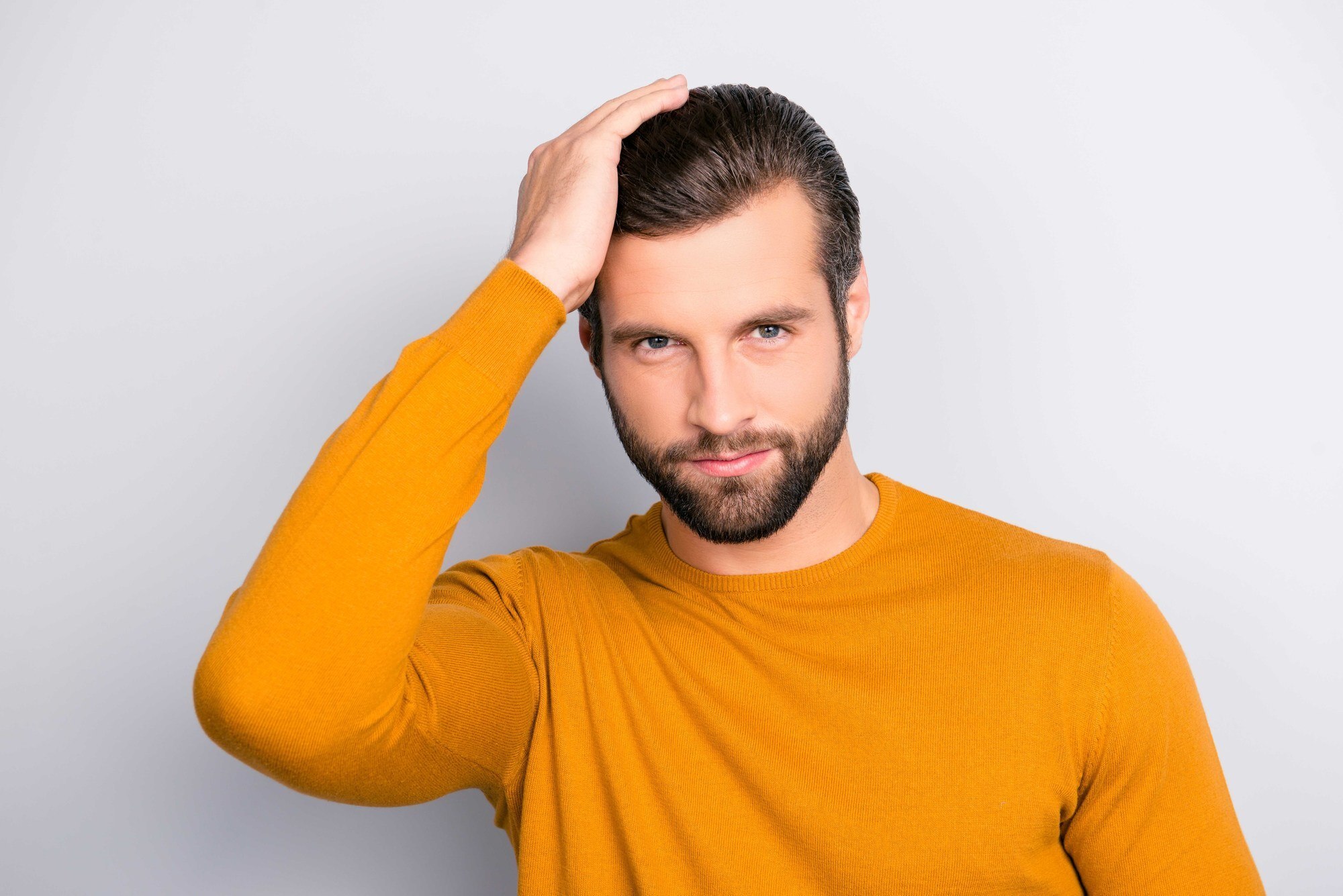 man with slicked back hairstyle
