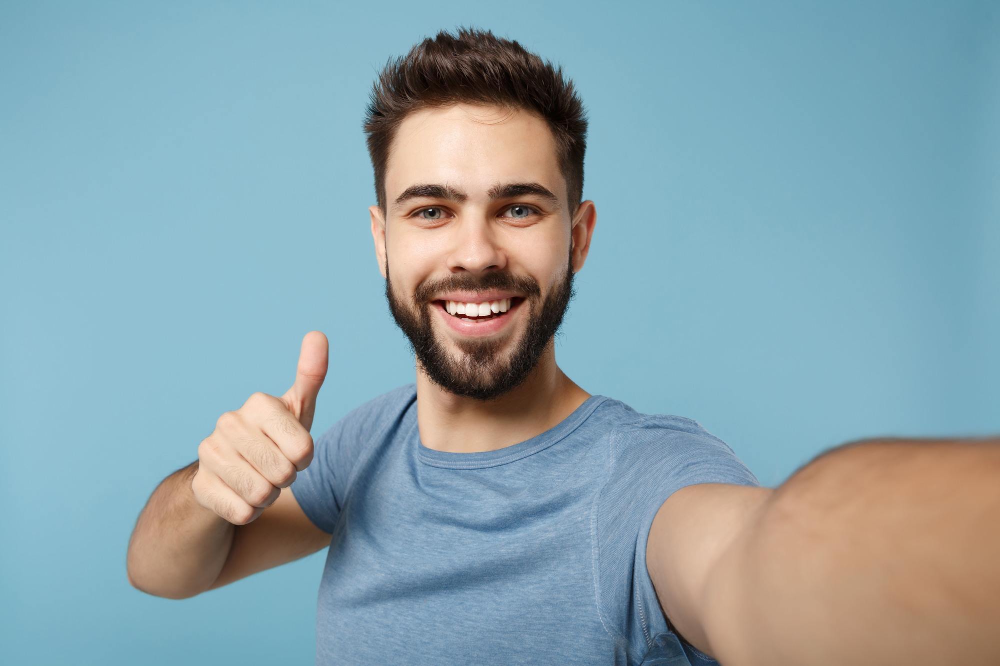 man with short quiff hairstyle and a close cropped beard