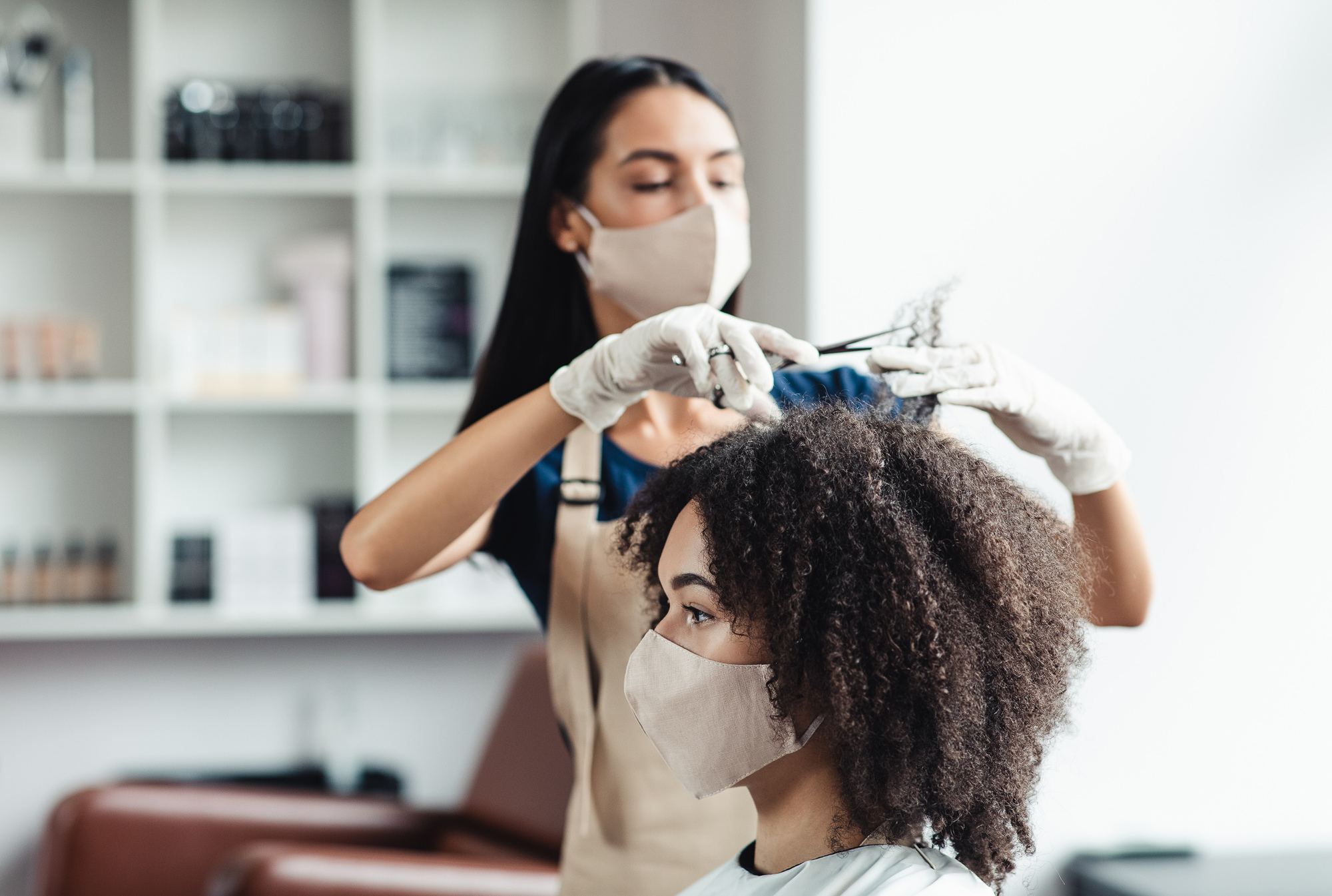 new year's resolutions: woman in a salon getting a her hair trimmed