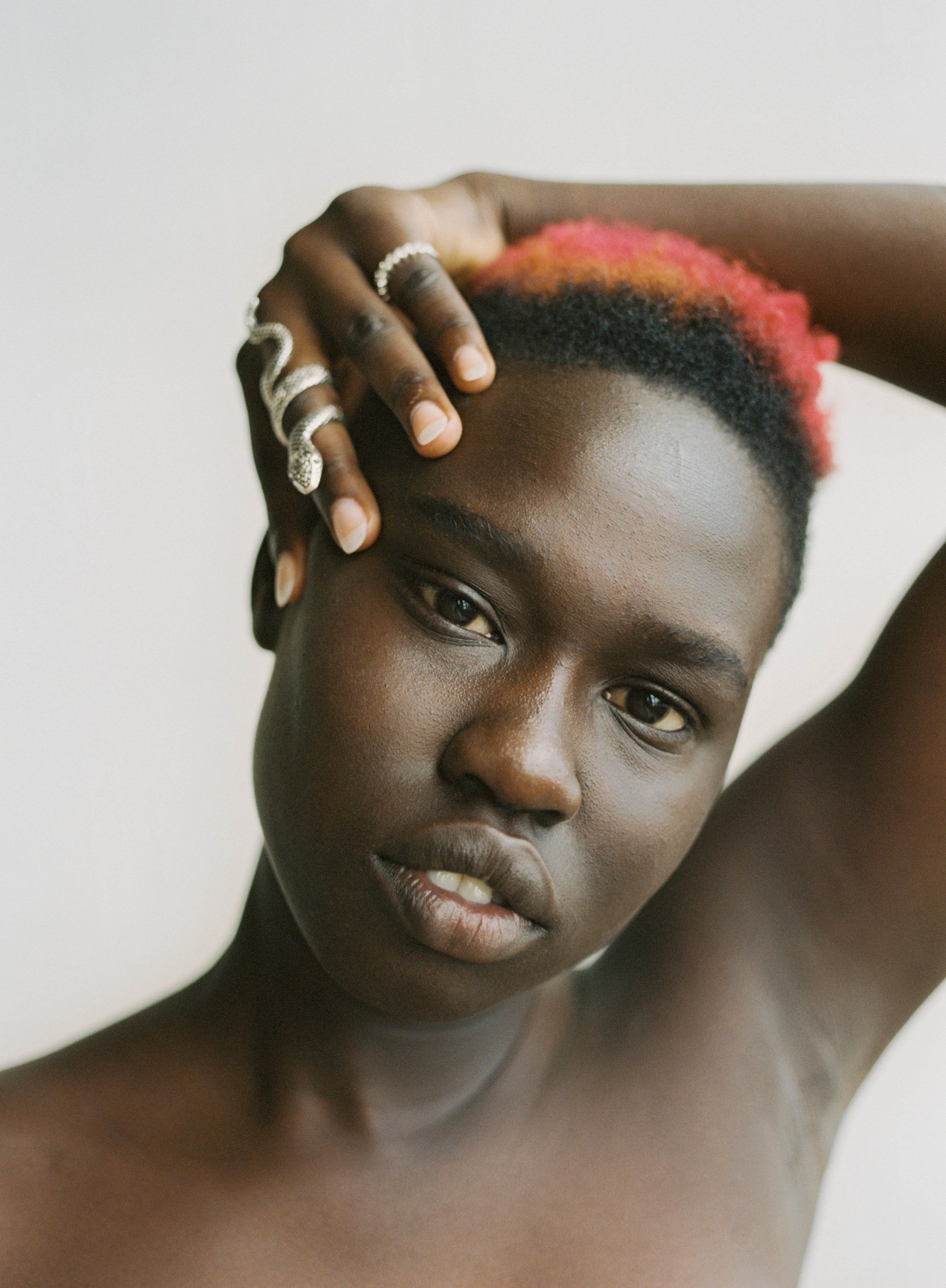 woman with short hair with a bright orange colour