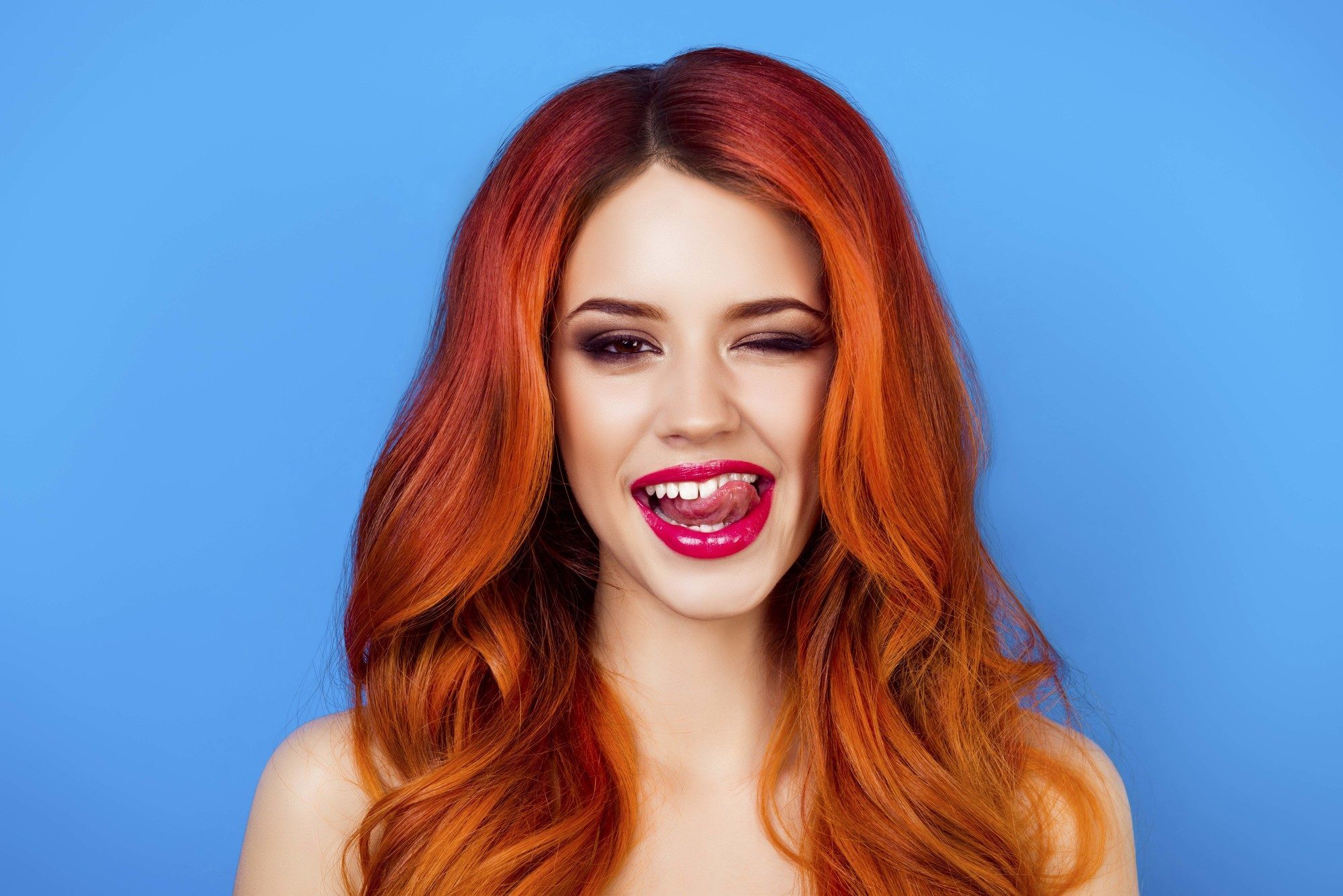 woman with funky orange hair ginger wavy hair