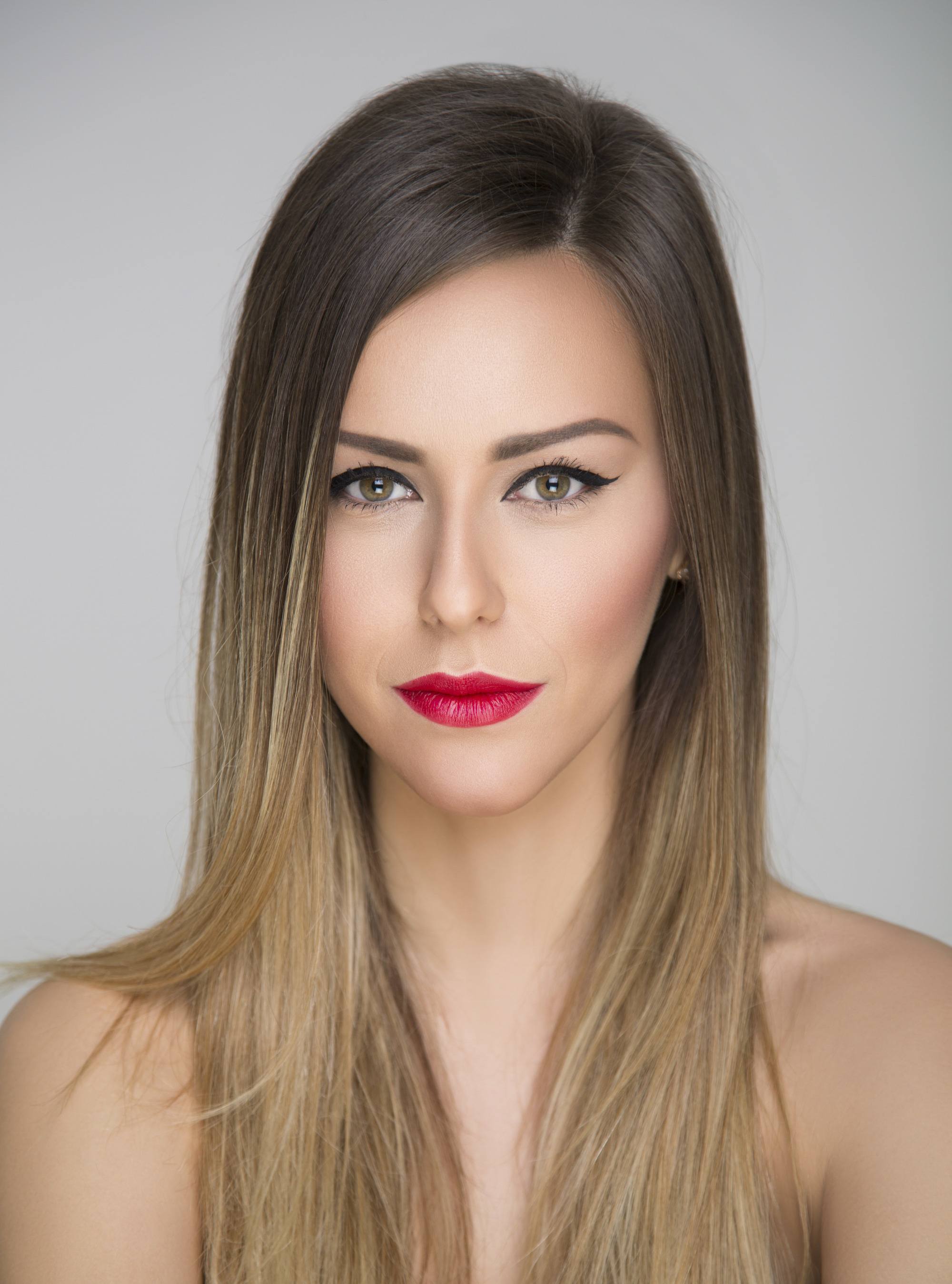 woman with dark hair brown rots golden blonde ombre