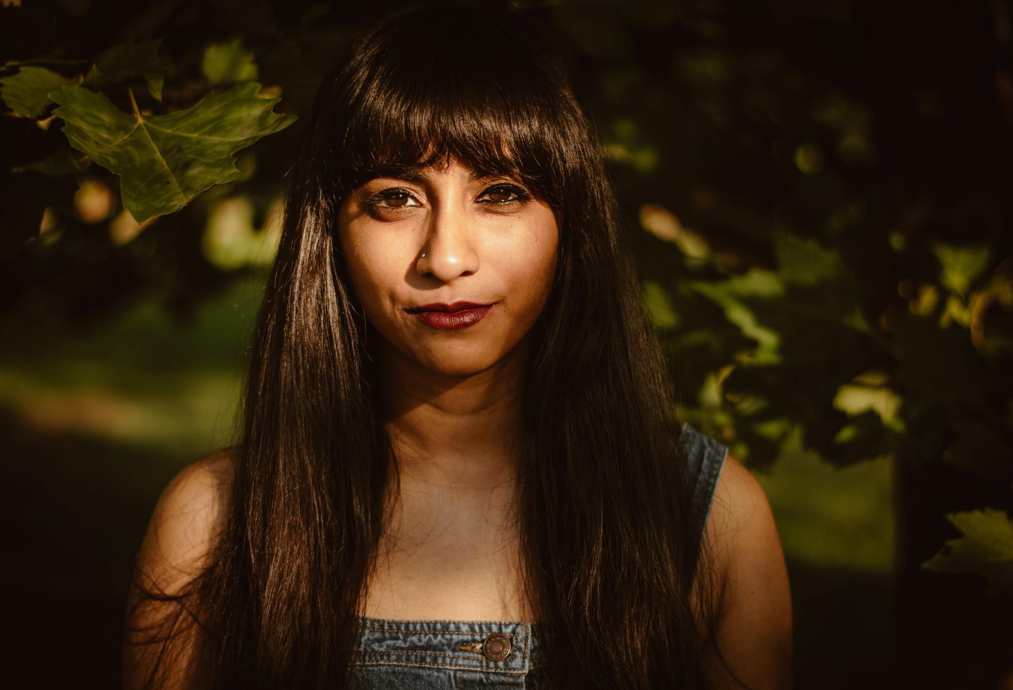 woman with long brown hair and a fringe