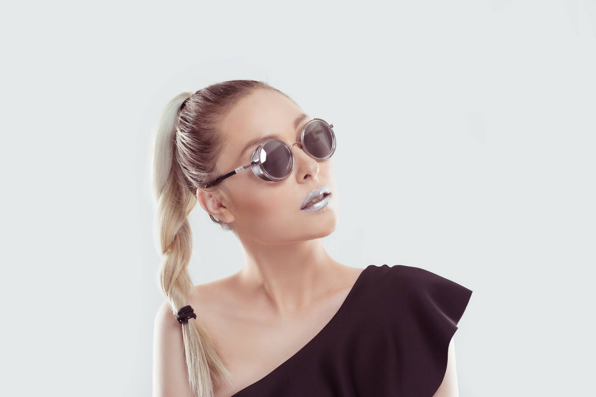 woman with blonde hair wearing a braided ponytail
