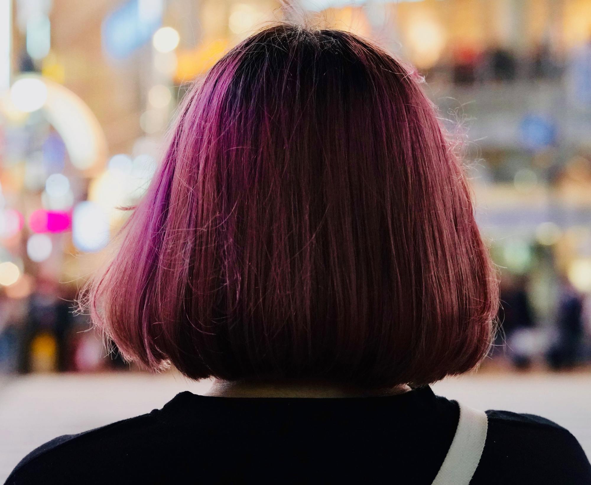 woman with purple hair and a faux bob