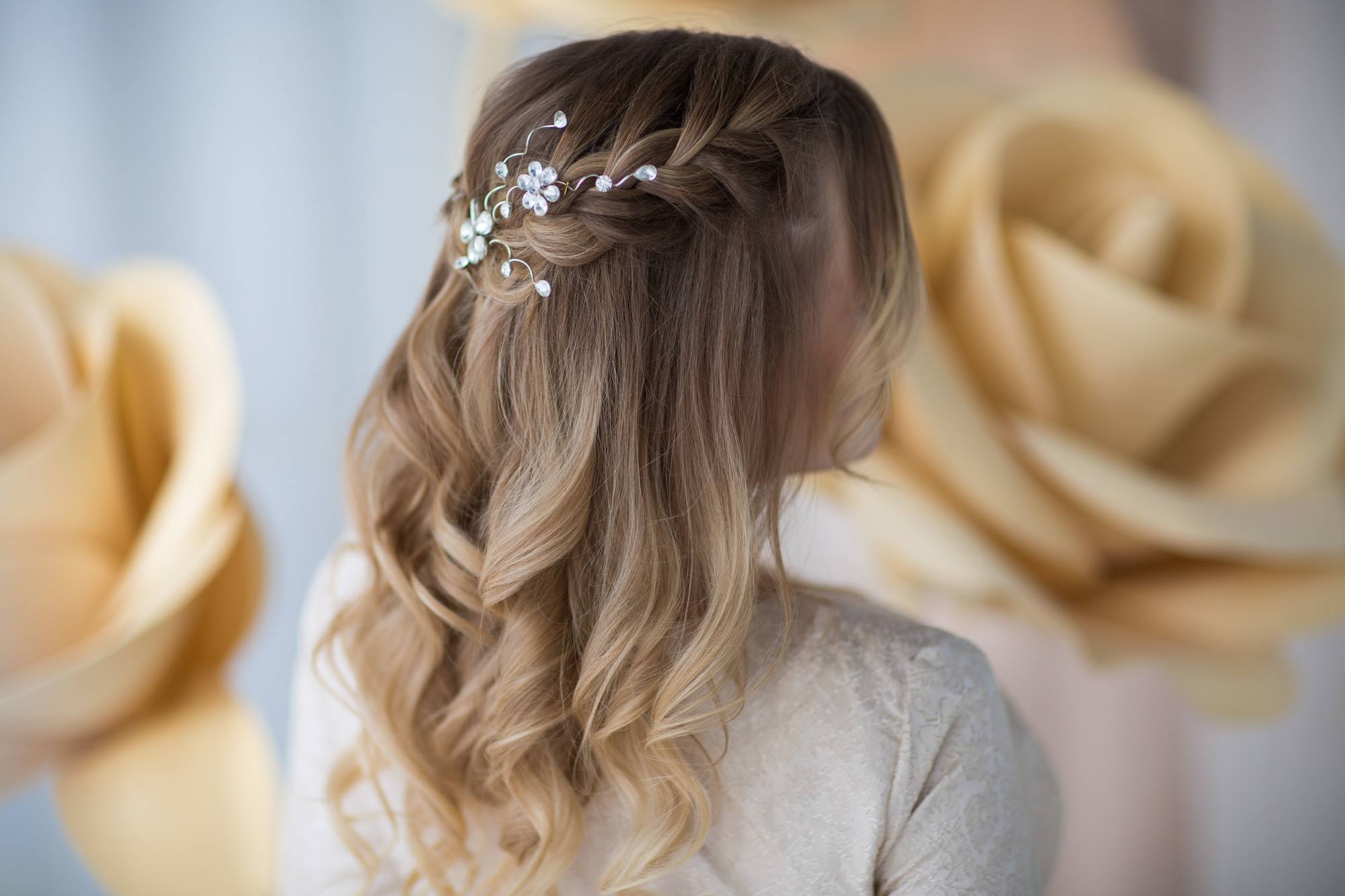 Engagement hairstyles: woman wearing fun braided half updo
