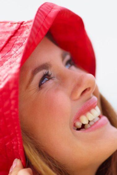 Woman wearing a red rain bonnet