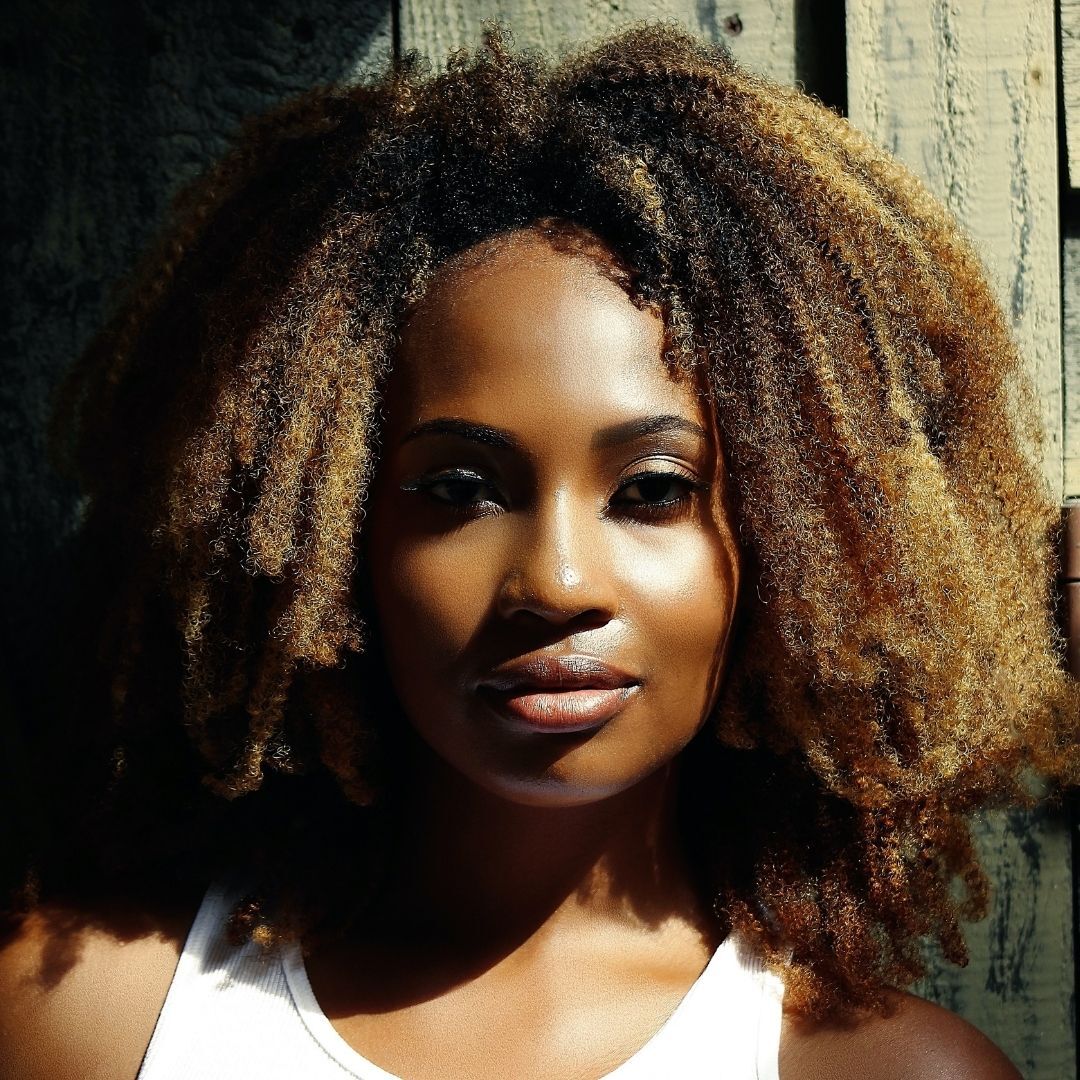 woman with natural hair and balayage