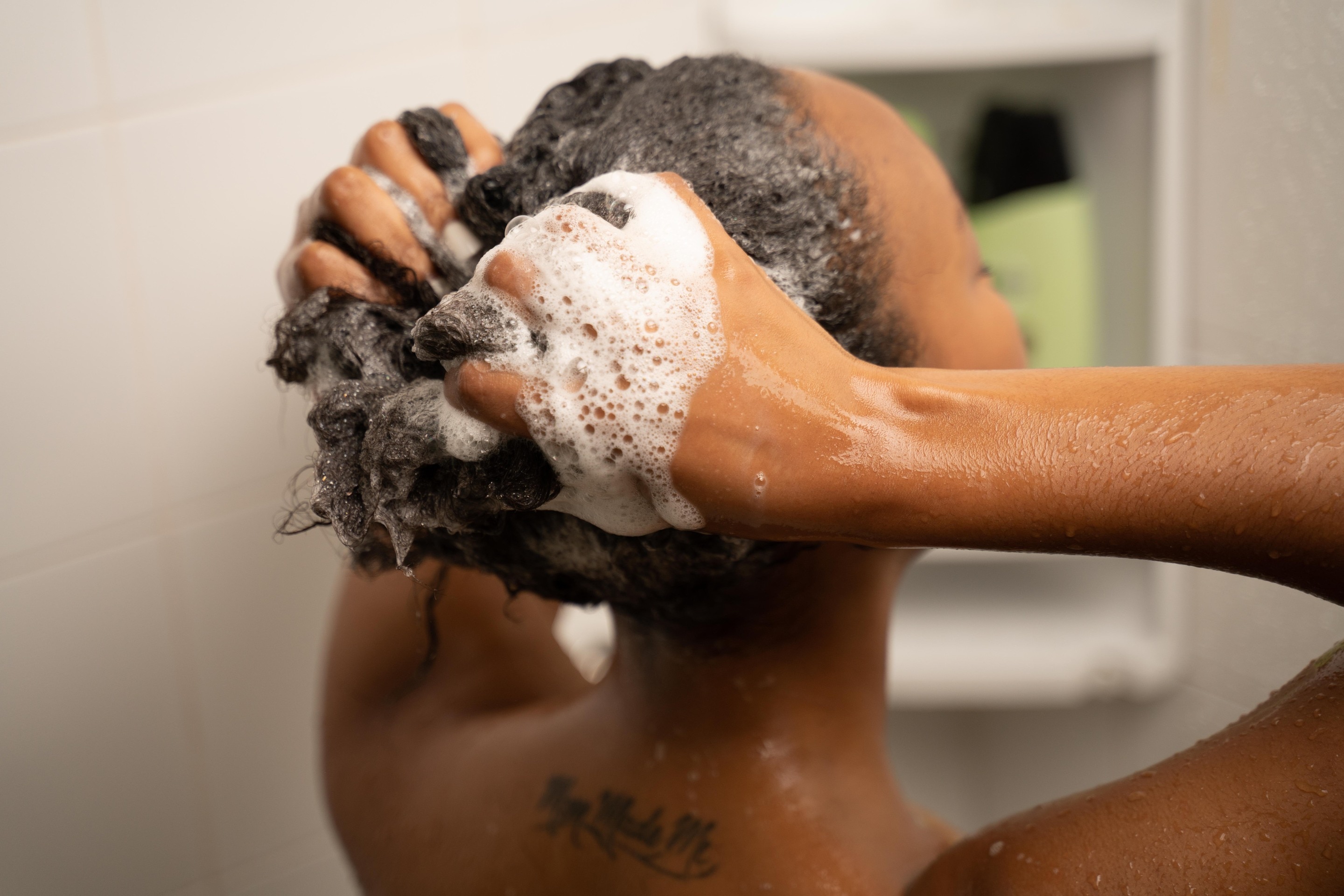 woman washing natural hair