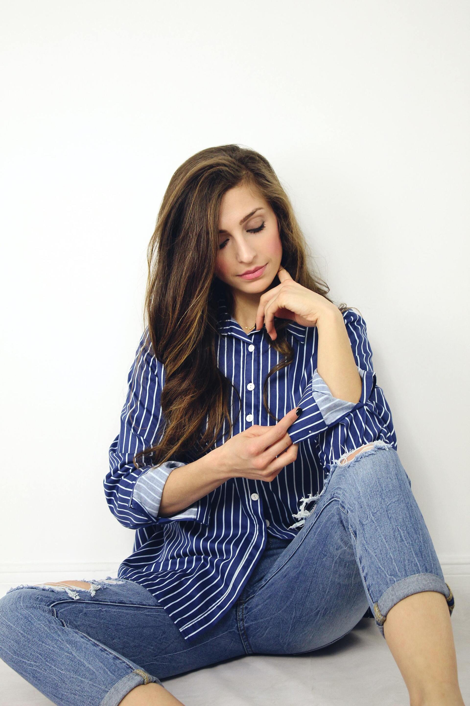 Woman with long brown hair that has been blown out