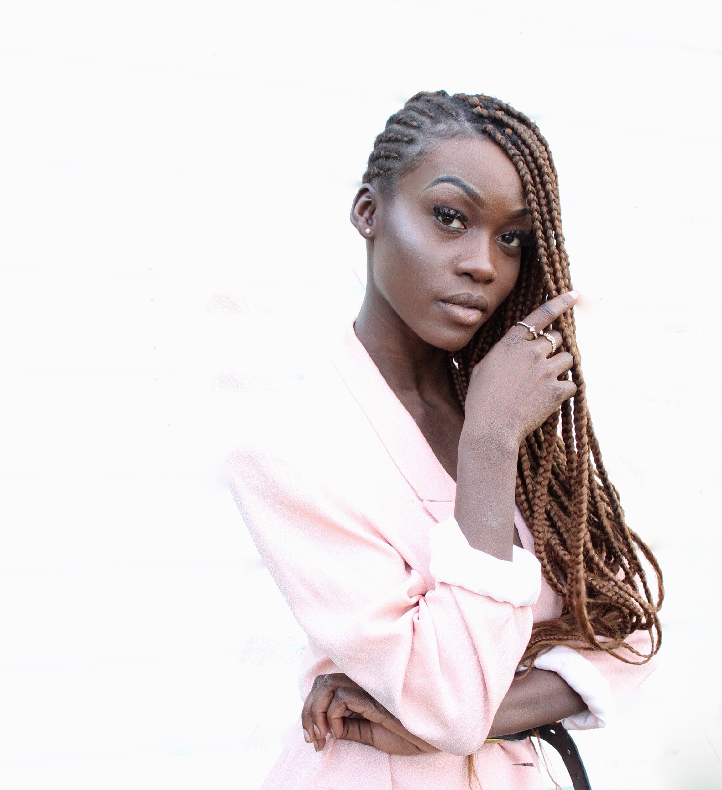 girl with long honey blonde box braids