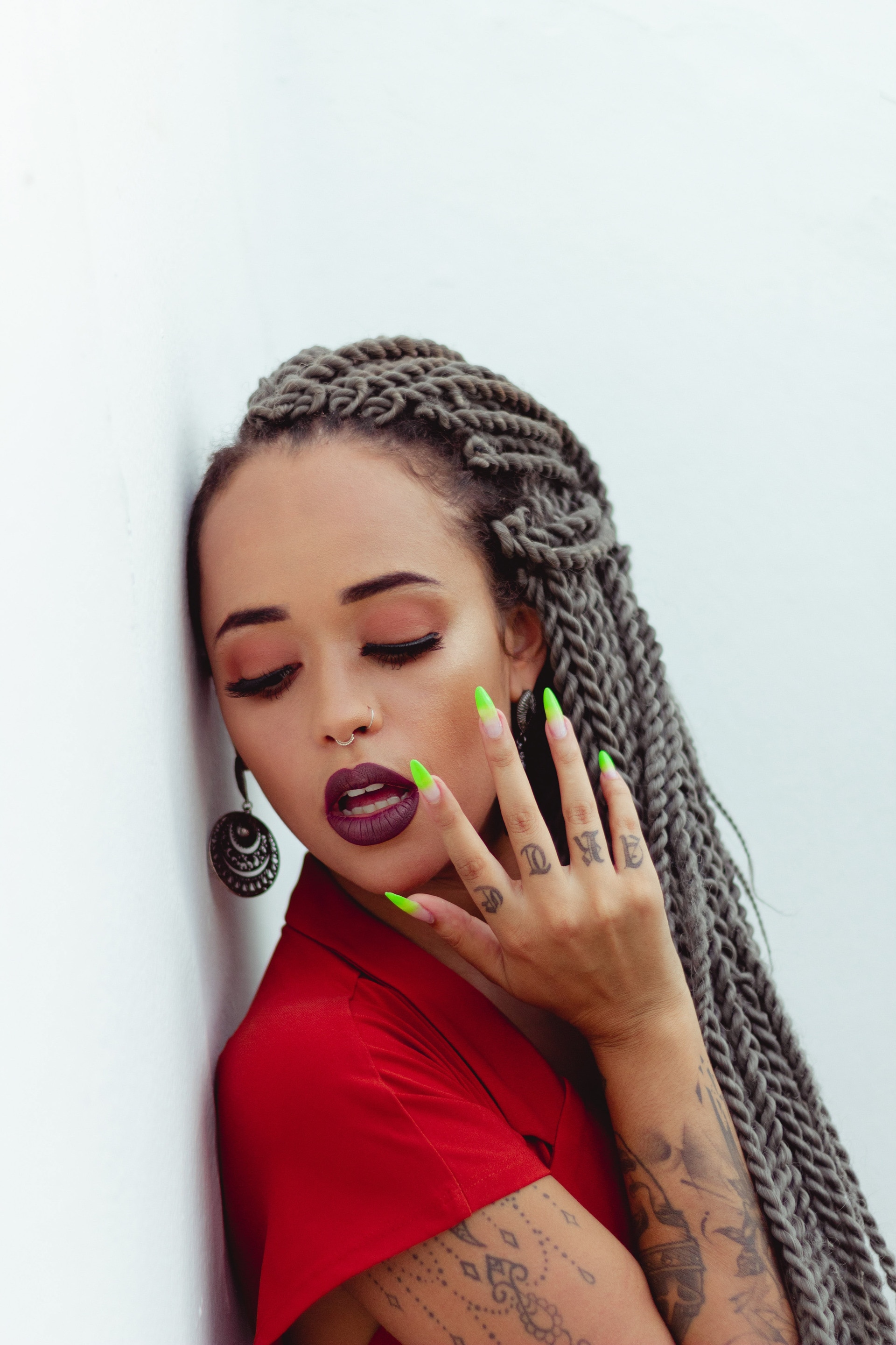 girl with grey yarn braids