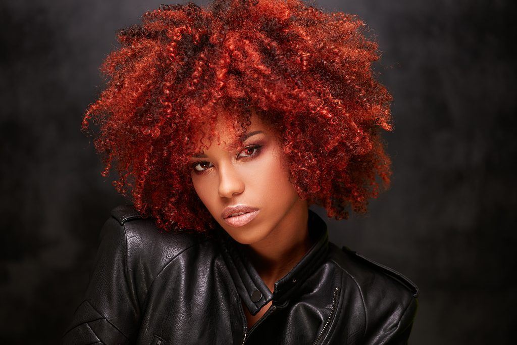woman with red tight curls