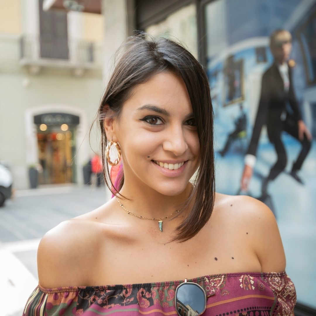 woman with medium length brown hair tied up in a ponytail