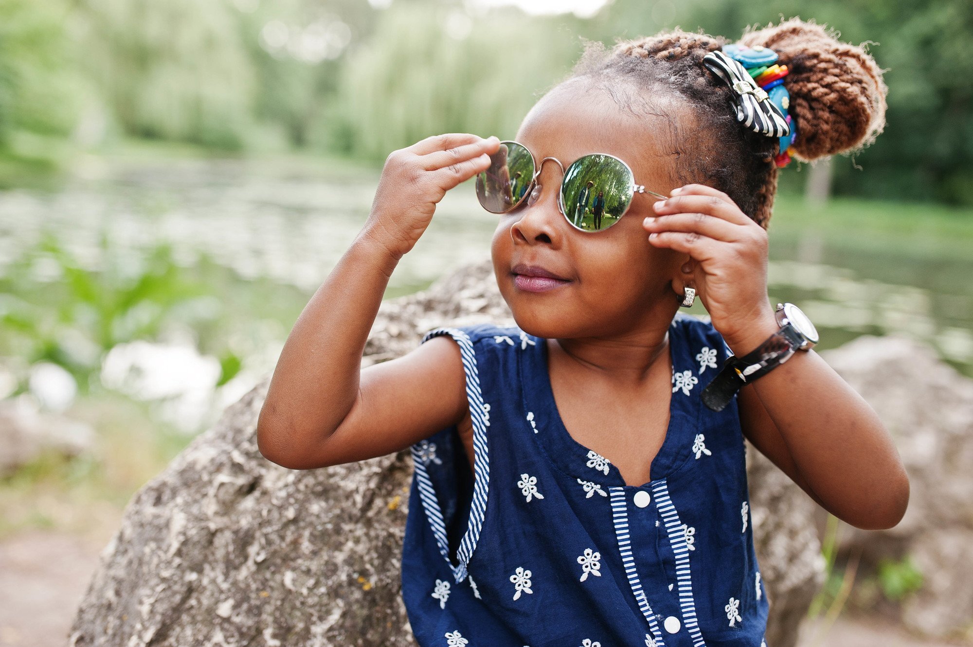 Little girl with twists and sun glases