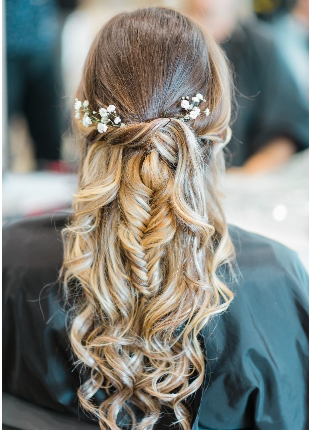 woman with a brown and blonde ombre Half-Up Half Down Braided Hairstyle