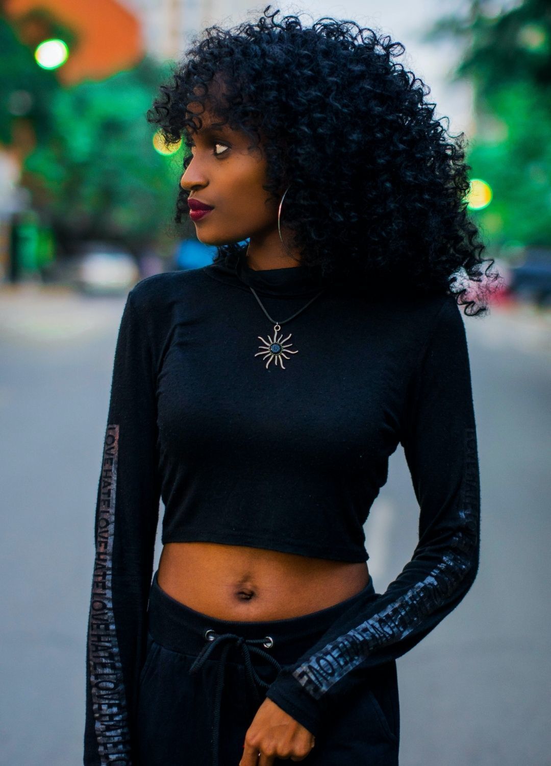 woman with long curly hair graduation hairtyle
