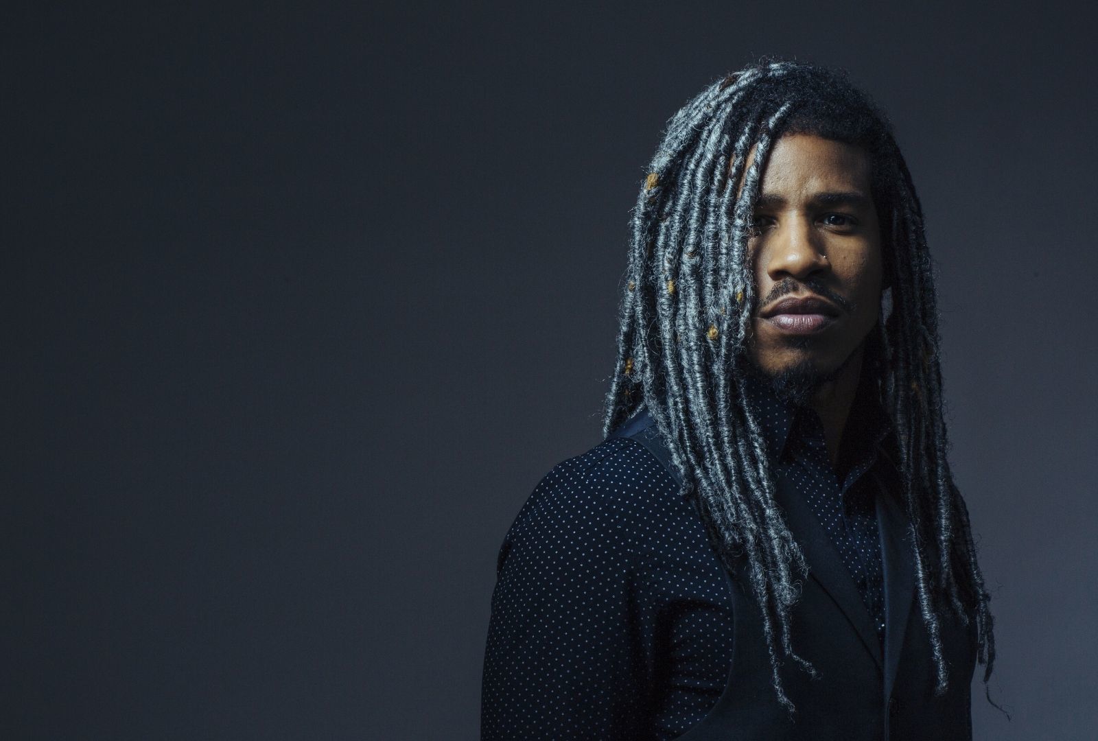 hair colours for men: man with long grey faux locs