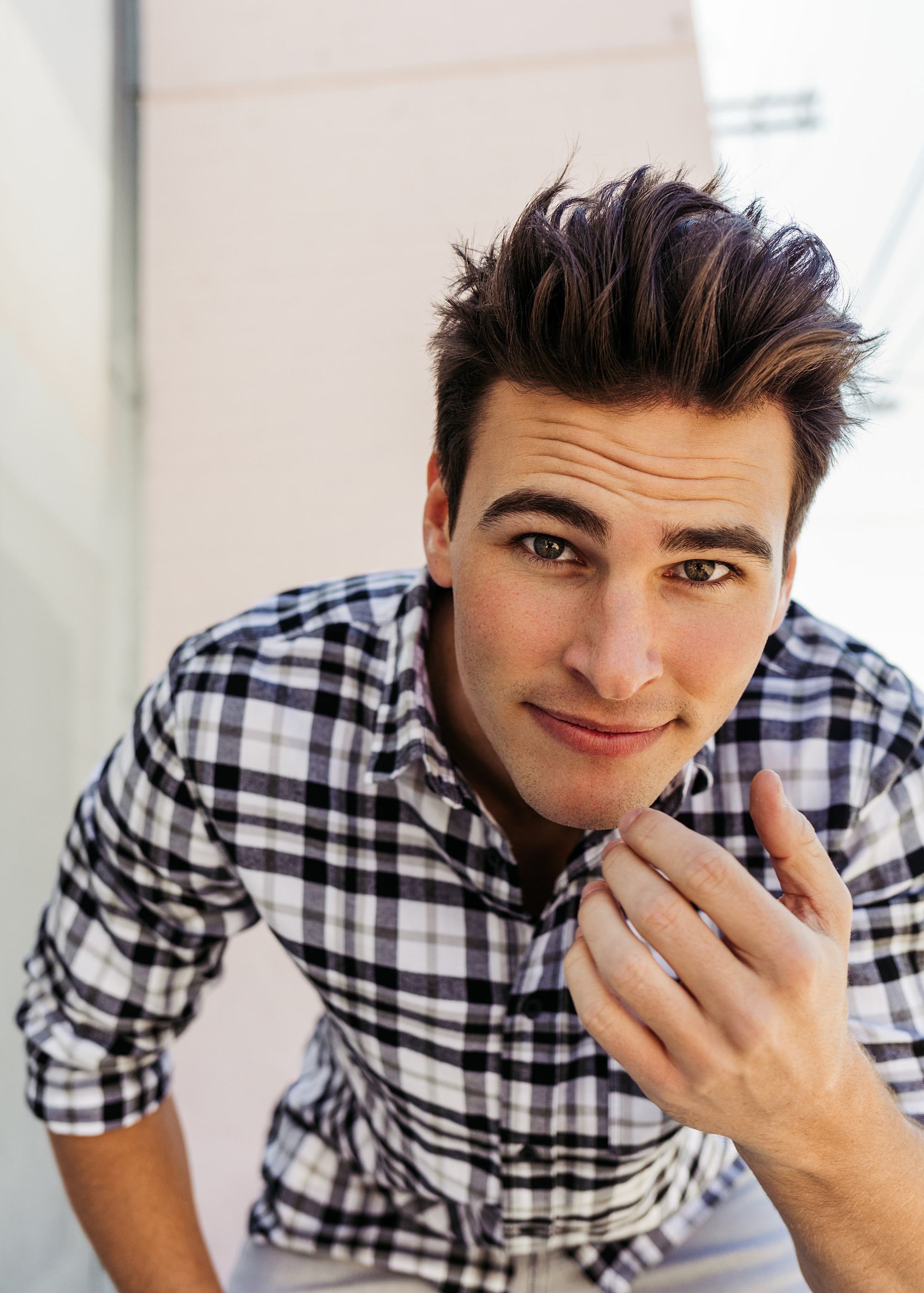 man with brushed back brown hair