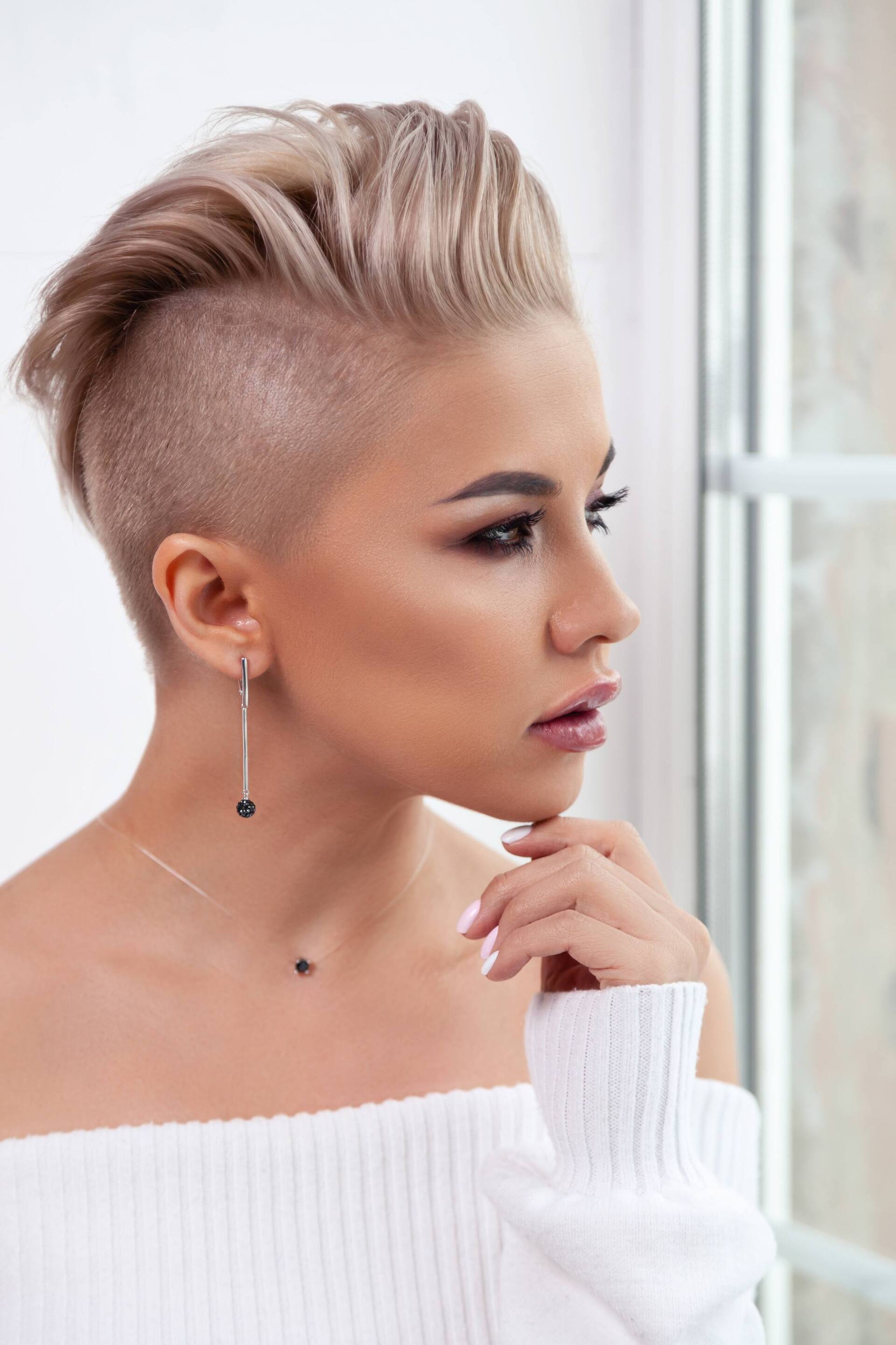 spring-worthy hairstyles: woman with short blonde hair and an undercut