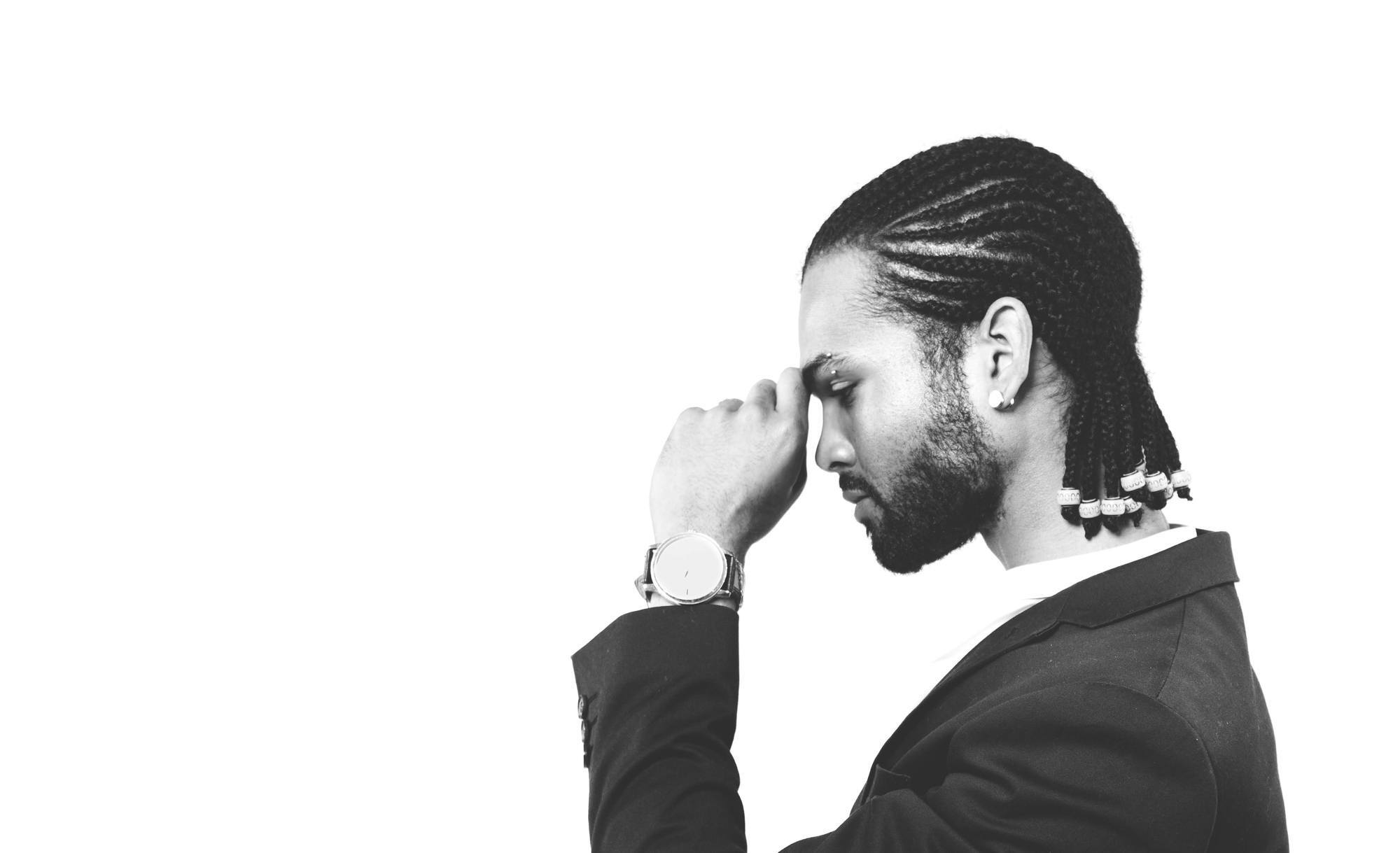 men's medium hairstyles: man with straight-back cornrows and beads at the end of each cornrow