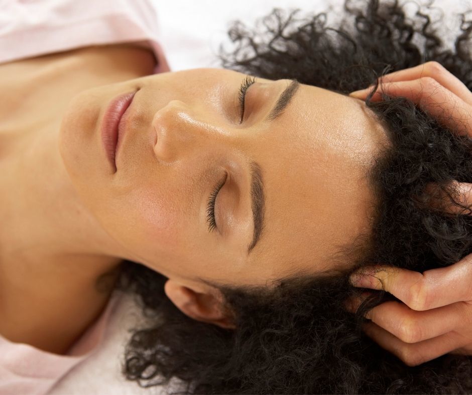woman having a scalp massage for self-care