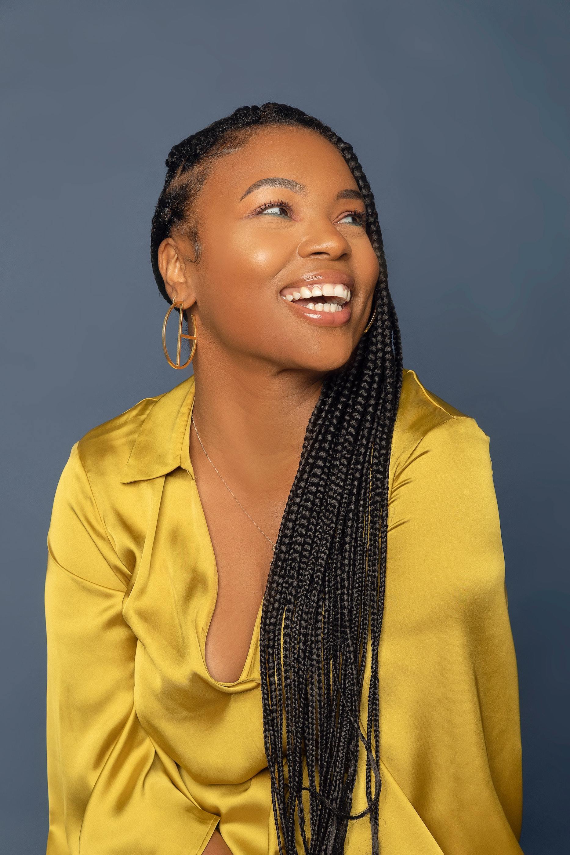 woman wearing a braided protective hairstyle: self-care Sunday