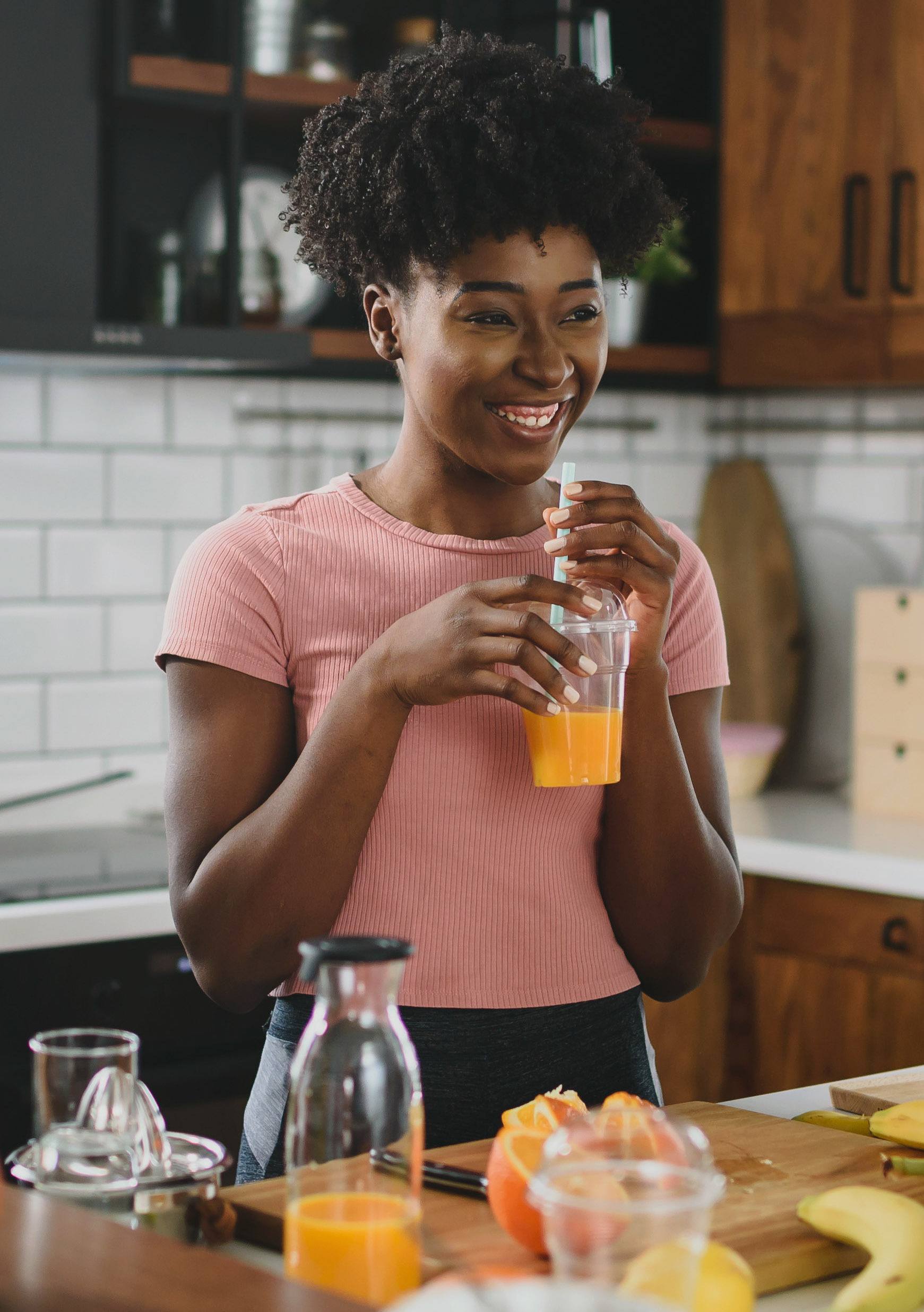 Woman drinking a smoothie to stay healthy