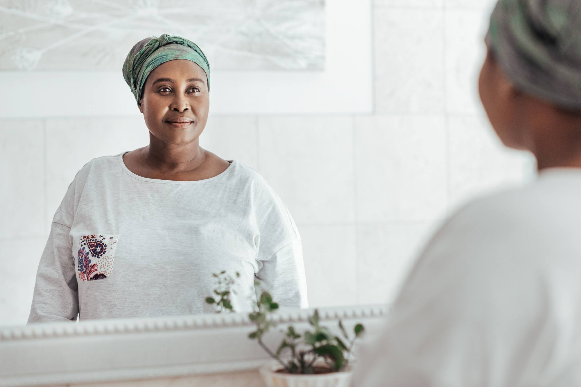 Woman looking into a mirror
