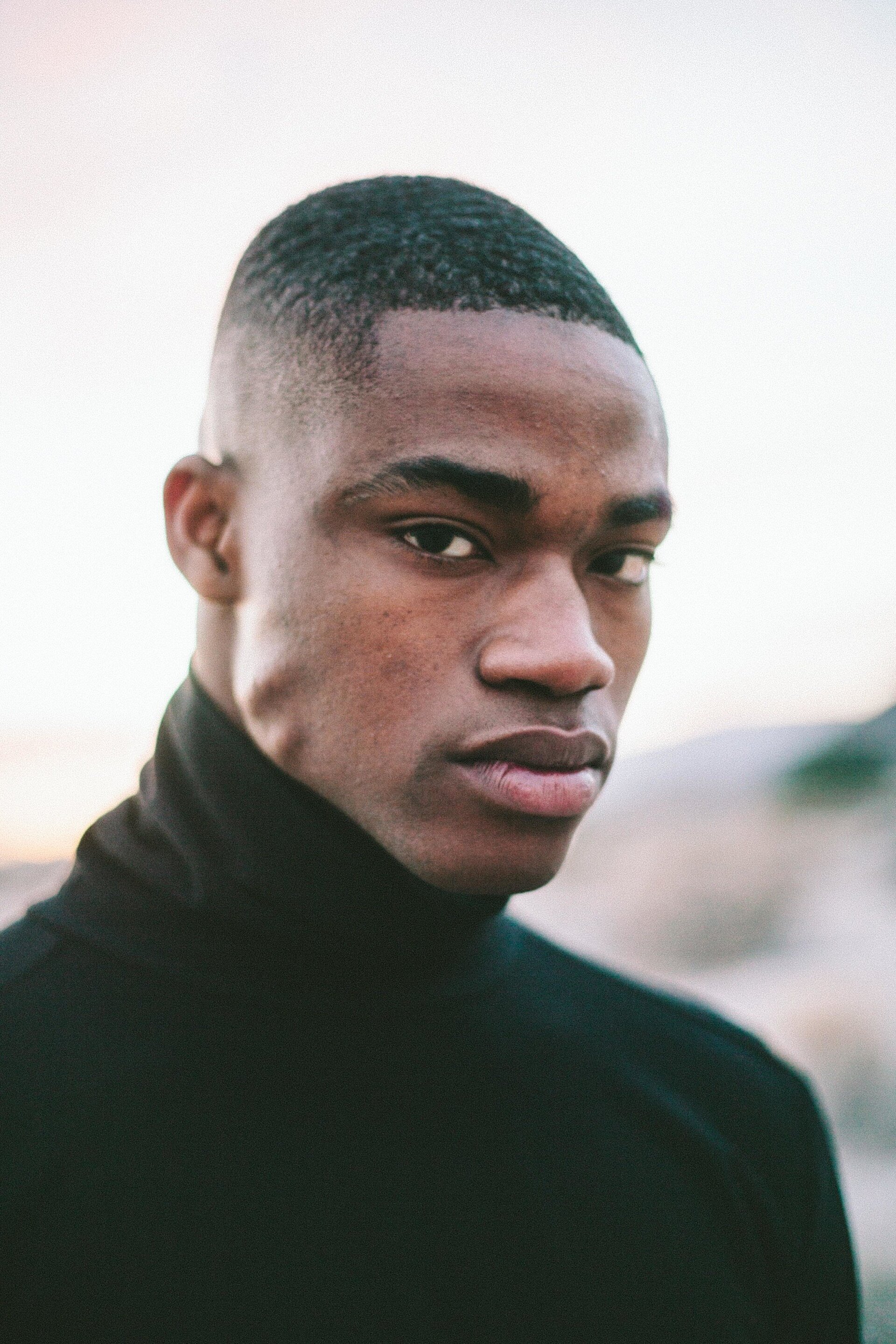 hairstyles for men with thinning hair: man with fade hairstyle