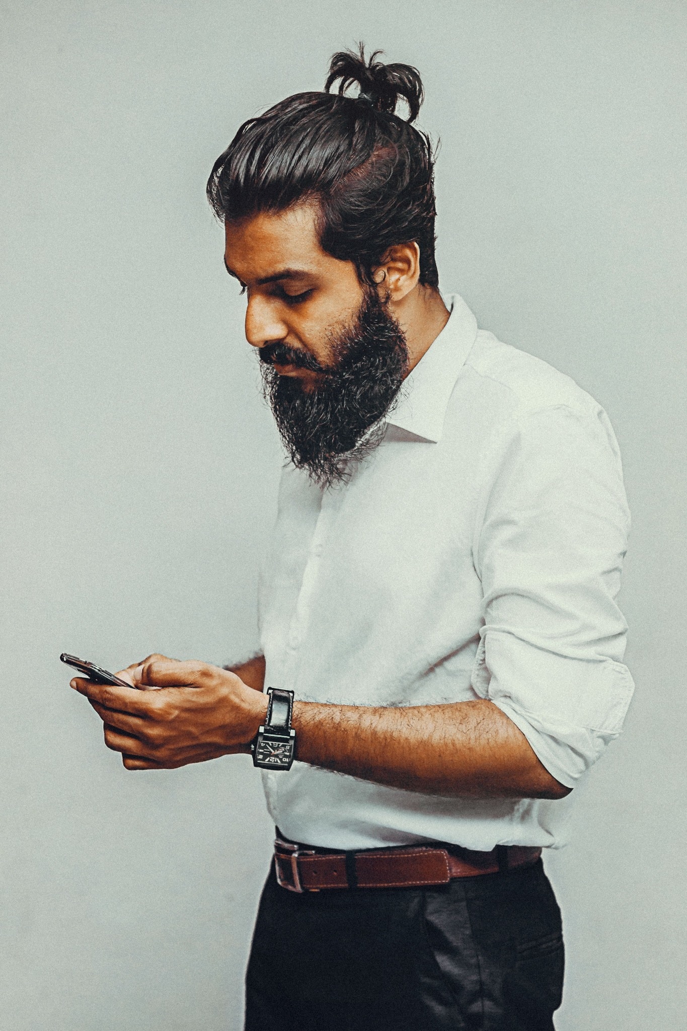 Half way man bun with beard