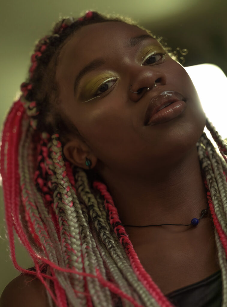 Woman with pink and blonde braids