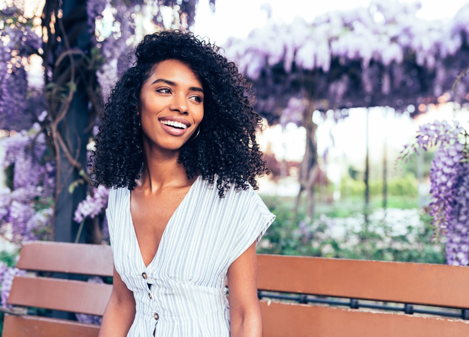low porosity hair: woman with long dark curly hair