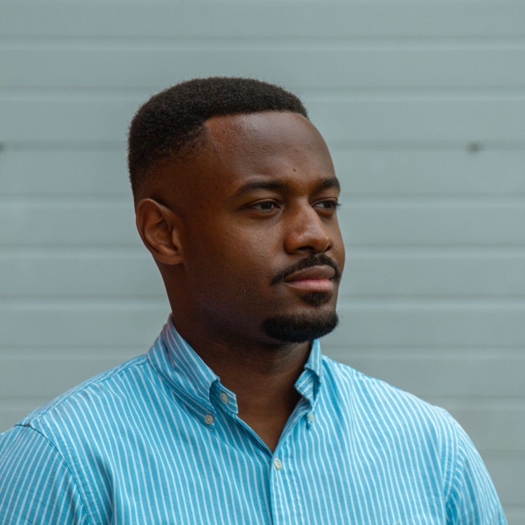 man with natural hair and a neat fade haircut