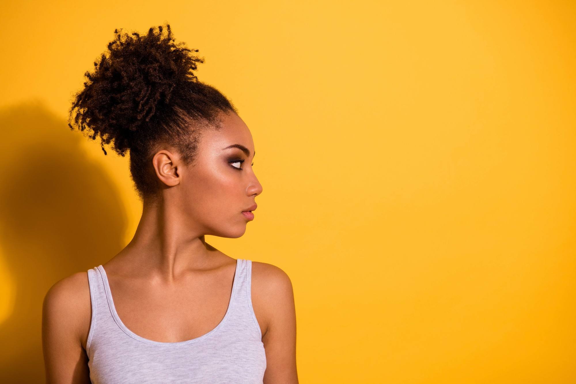 woman wearing a high puff for work