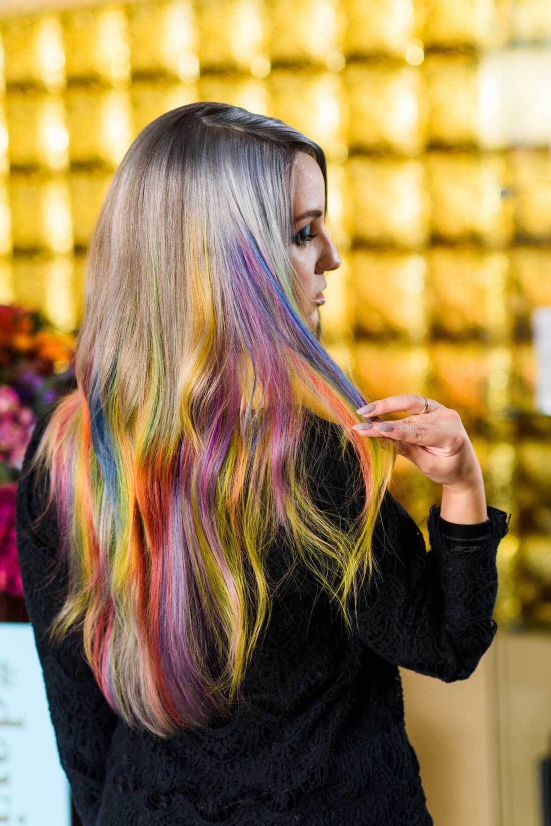 Pride: woman with rainbow hair balayage