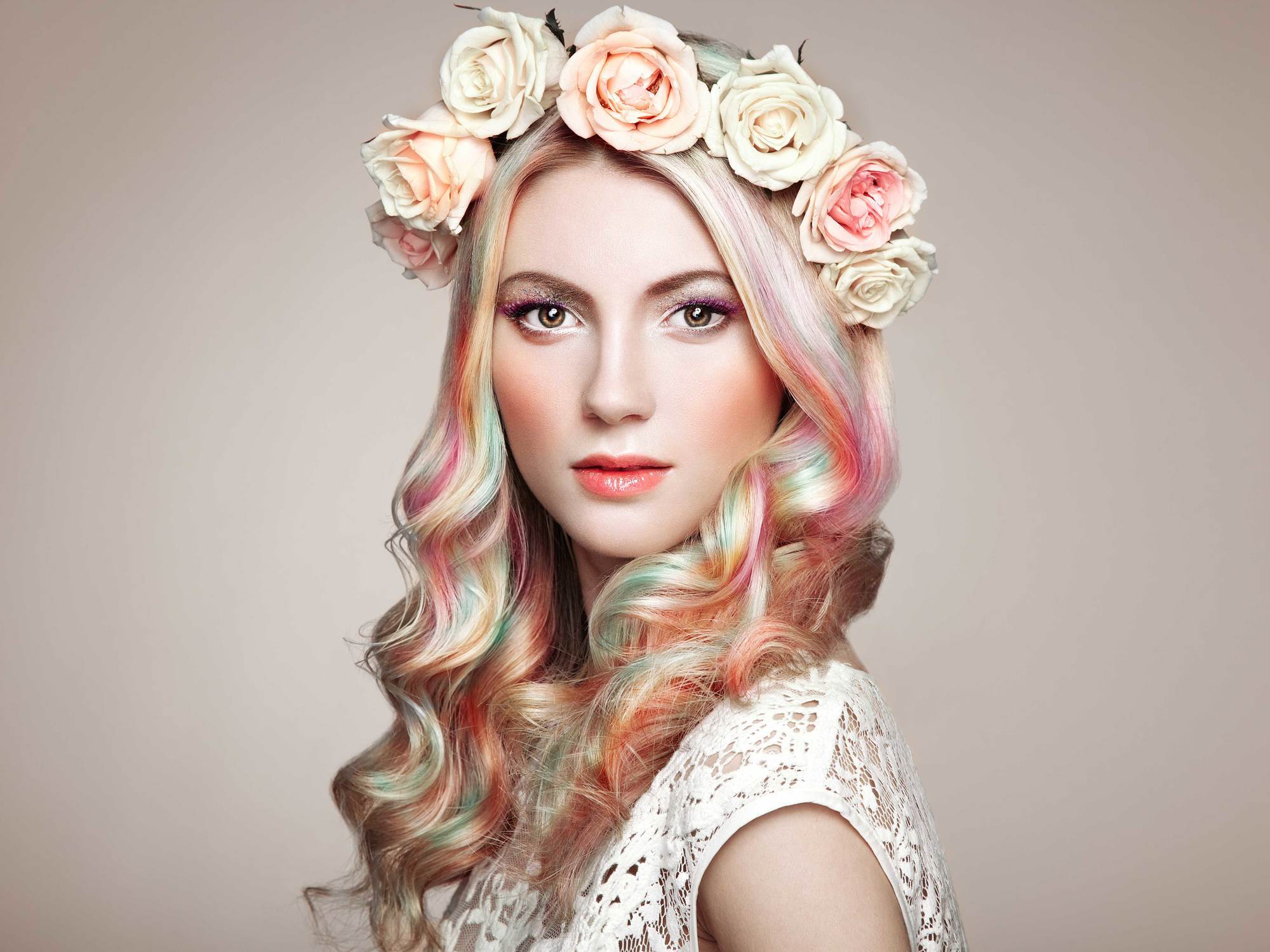 woman with blonde and pastel hair and flower headband accessory