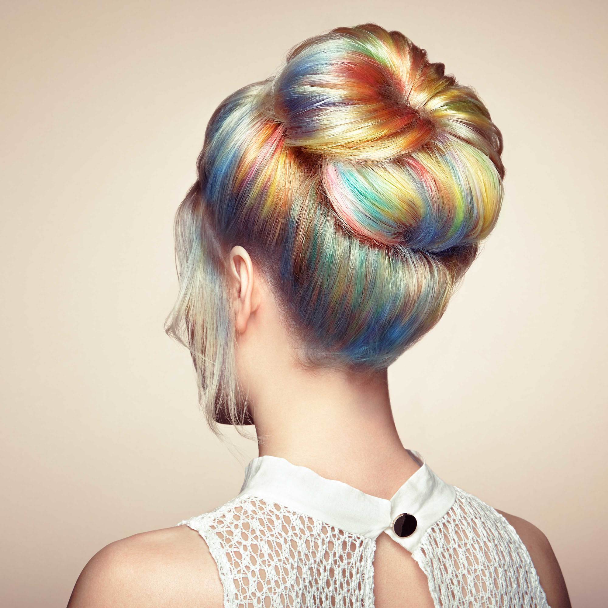 woman with rainbow hair bun hairstyle