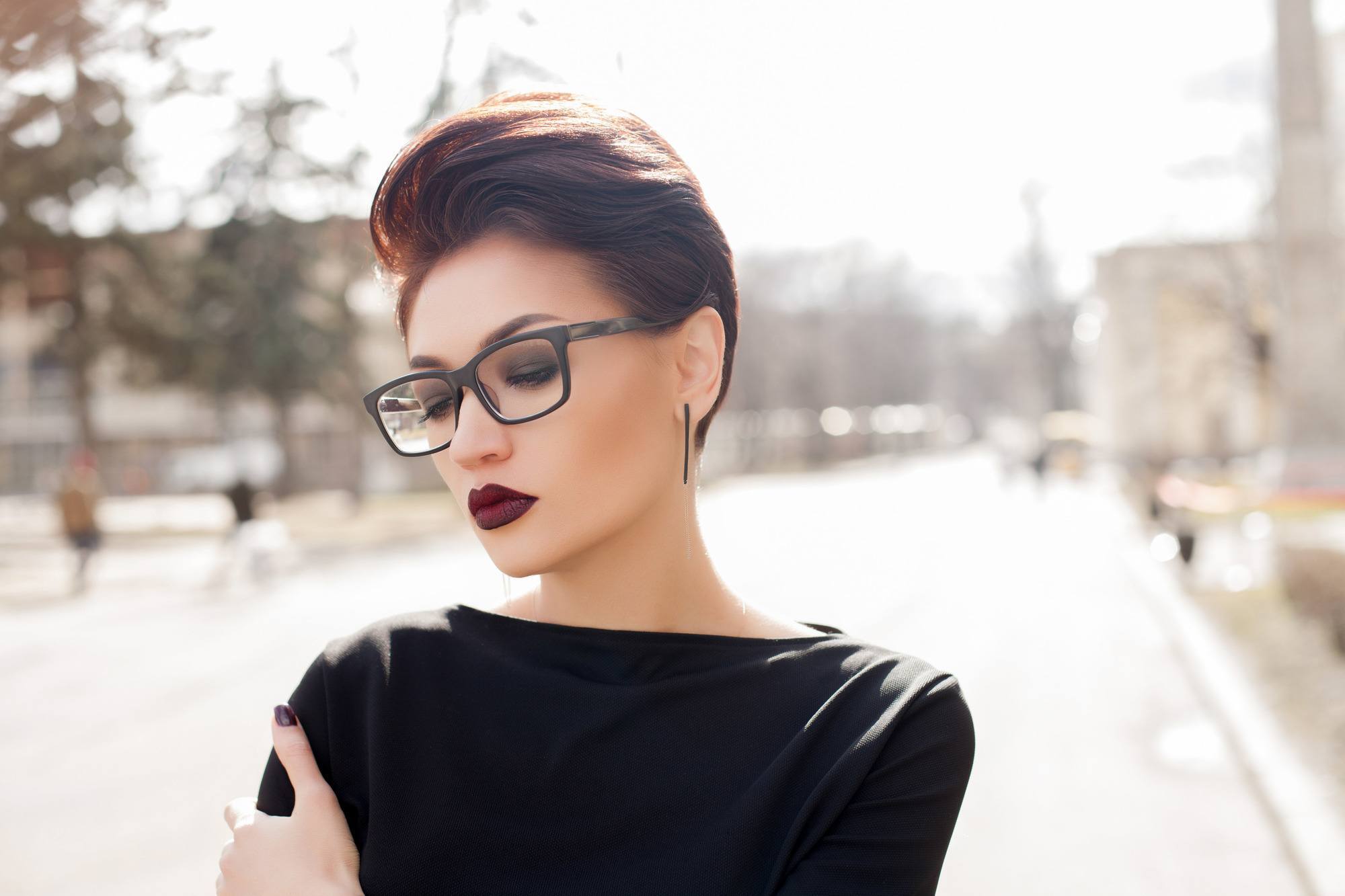 hairstyle: woman with short brown hair wearing a slicked quiff