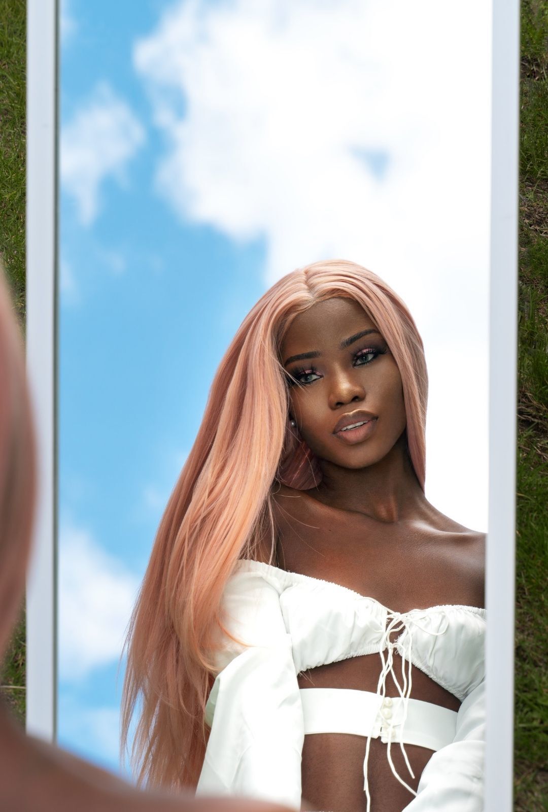 woman with long, pastel peach-coloured hair