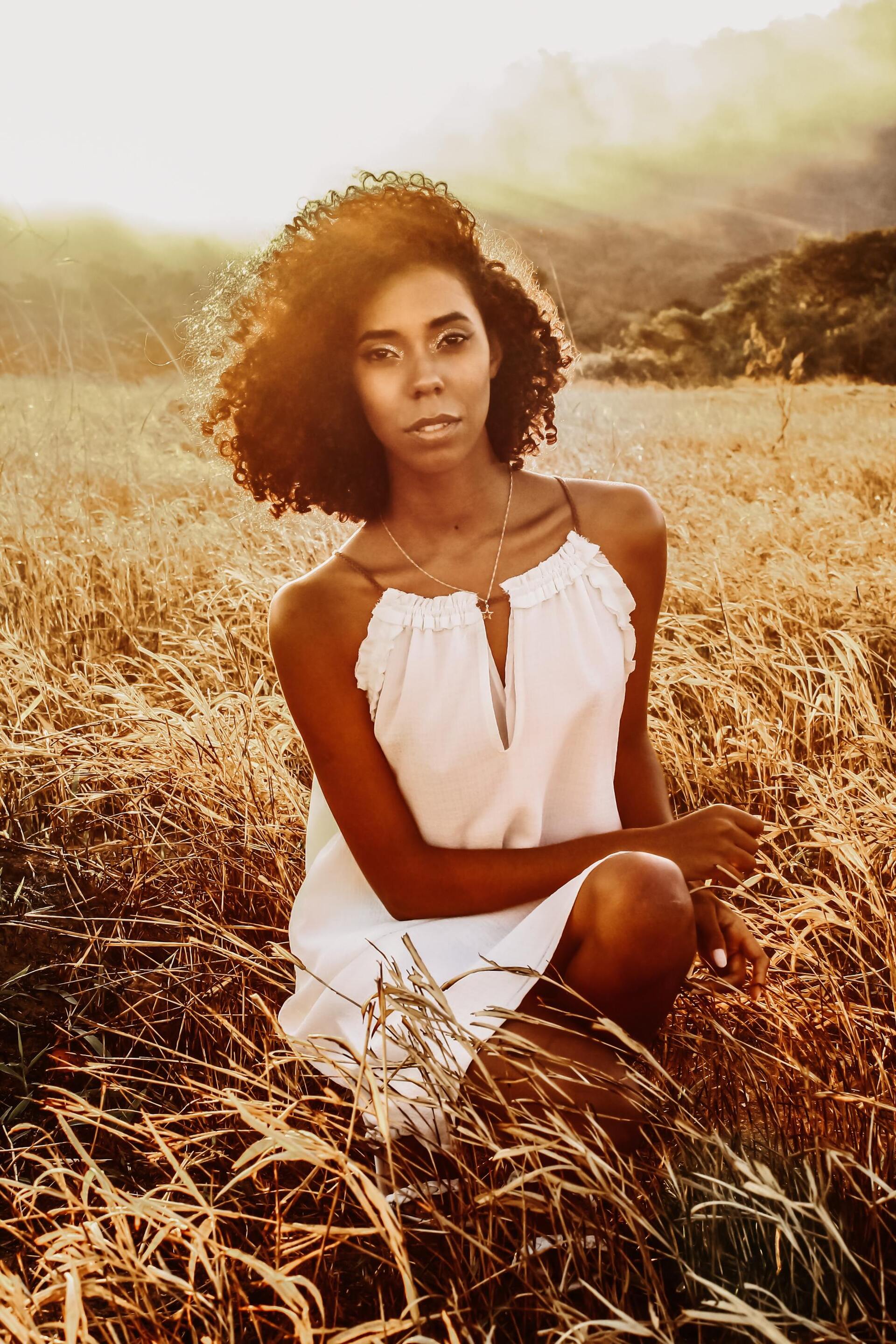 woman with medium-length naturally curly hair
