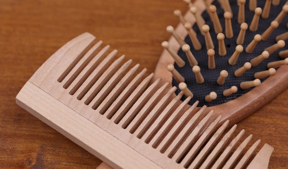 change of season: image of a wooden comb and brush