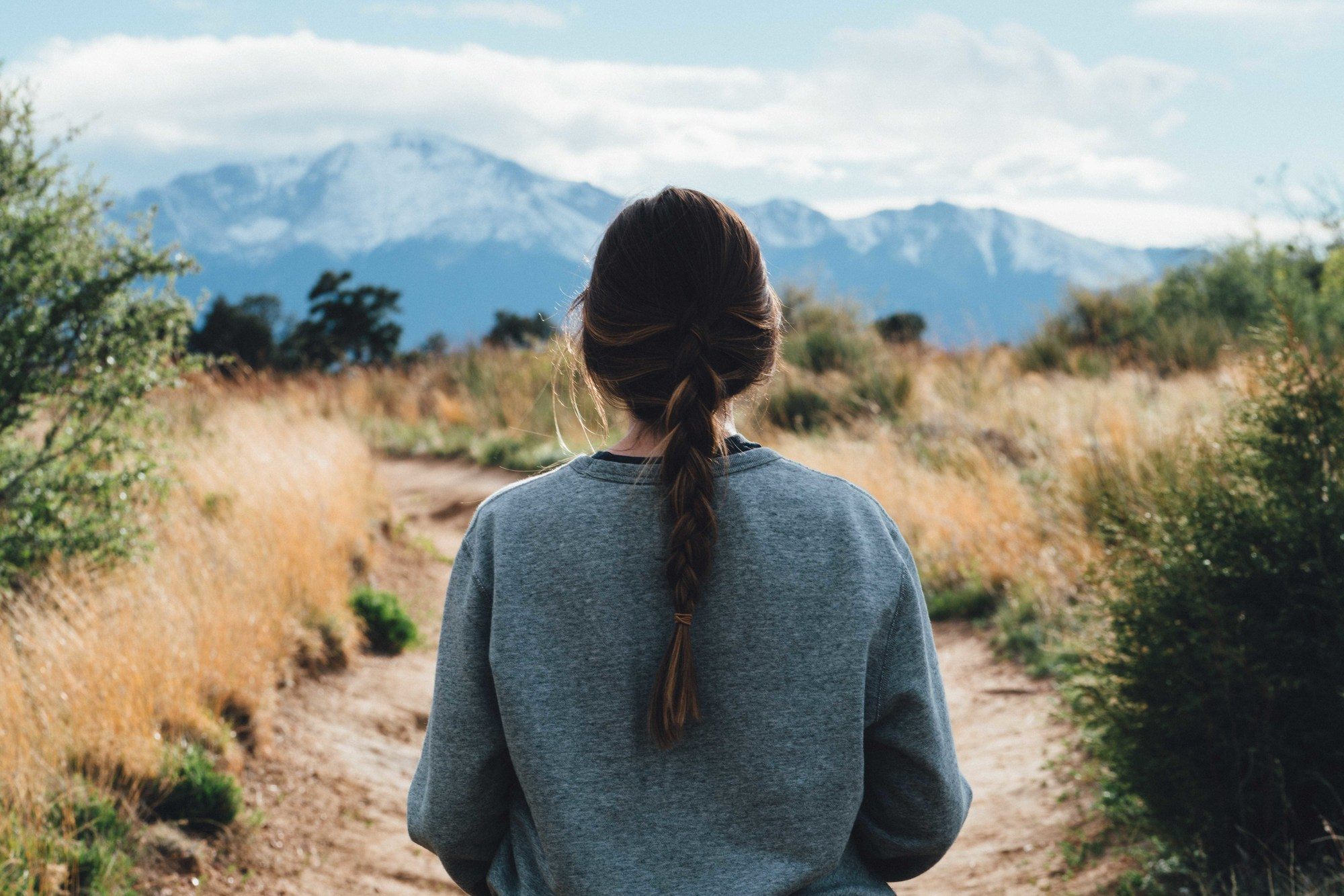 woman with long loose plait ponytail hairstyle